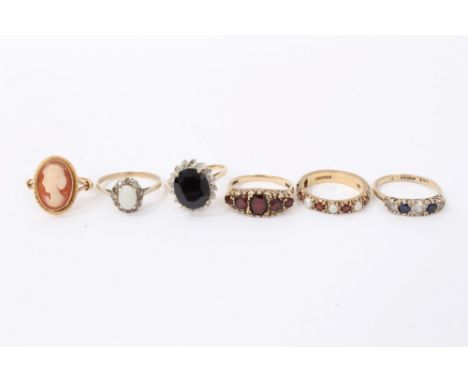 Six gold rings including gold (9ct) garnet five stone ring, other gem set rings and cameo ringCondition report: Cameo ring no