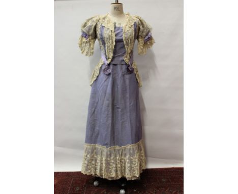 Victorain pale lilac grosgrain boned jacket and matching skirt with gathered lace trim. Skirt has space for a bustle and unde