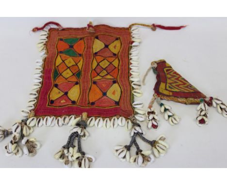 Collection of Antique Banjara textiles three pieces with cowrie shells including an embroidered cow horn cover, a square Ruma