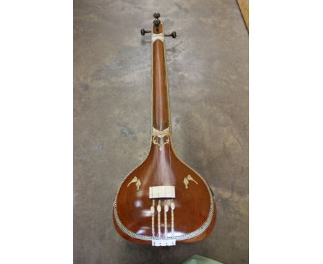 North Indian drone lute, also known as a tambura or tampura, with carved and inlaid decoration, in cloth case