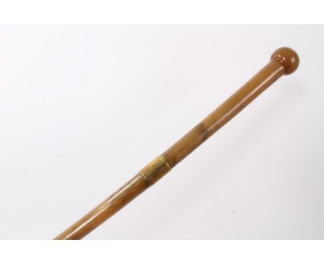 Late 19th/early 20th century Rhino Horn walking stick with metal collar and integral rondel handle, 77cm overall length