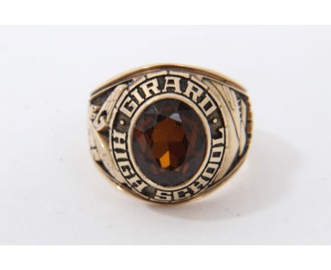 Gold (10k) Girard High School ring with a central brown oval faceted stone, fly logo and building date 1981 (EST 1875), ring 