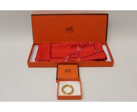 Hermes red silk scarf 1983 'Bolduc' designer Jean-Louis Dumas and Hermes gilt metal scarf ring, both boxed
