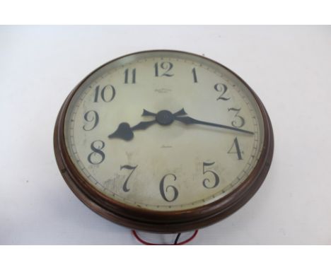 Synchronome Electric wall clock, the circular dial with black enamel Arabic numerals in anodised brass case. Formerly from Wh
