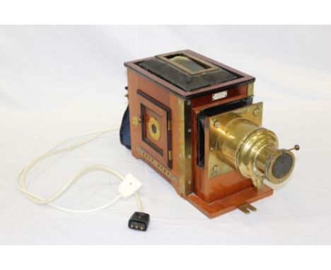 Cased magic lantern by Erken, Son &amp; Co, large quantity of magic lantern slides, and a brass and oak tripod. (5)