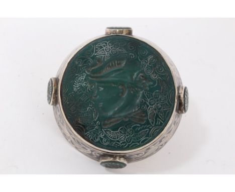 Unusual silver and intaglio double ring, the large circular intaglio greenstone plaque measuring approximately 51mm diameter,