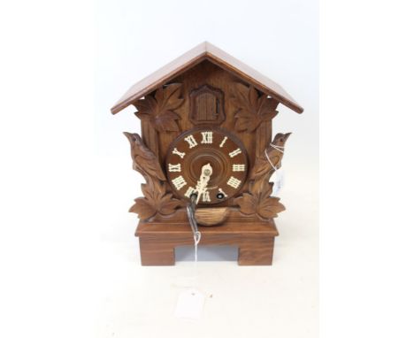 Black Forest carved cuckoo clock, the movement by Hubert Herr of Triberg, Germany, total height 34cm