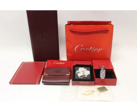 Cartier purse in red suede pouch, Cartier long bifold card case, other Cartier items include boxed purse mirror and key ring 