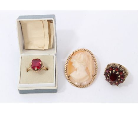 9ct gold garnet cluster ring, size L½, 9ct gold red stone ring, size M and a gold 9ct mounted carved cameo brooch (3)Conditio