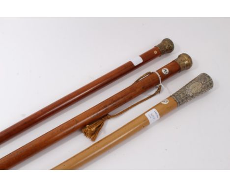 Early 19th century Malacca walking cane with suspension cord and guilt metal top embossed with a hunting scene and the image 