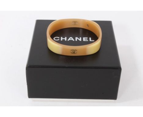 Vintage Chanel beige/cream plastic bangle with CC logo either side and oval Chanel tag to inside of bangle, in box
