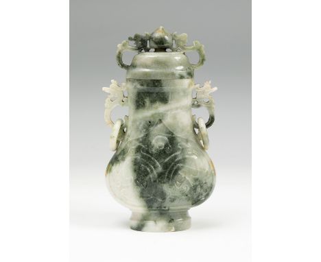 Perfumer. China, early 20th century.Jade veined-hard stone.Measurements: 18 x 10 x 5 cm.Chinese perfumer of periform format, 