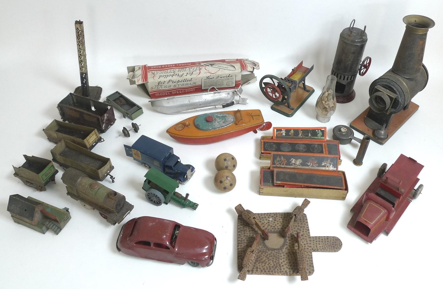 A group of vintage tin plate toys, including a Silver Streak model ...