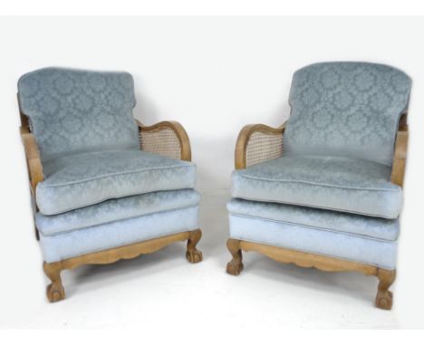 A 19th/early 20th century Bergere sofa and pair of armchairs, all with blue upholstered seats, chair 66.5 by 86.5 by 92 high,