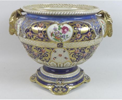 A Continental porcelain jardiniere, 19th century, possibly Samson of Paris, with twin ram's head handles, decorated in Imari 