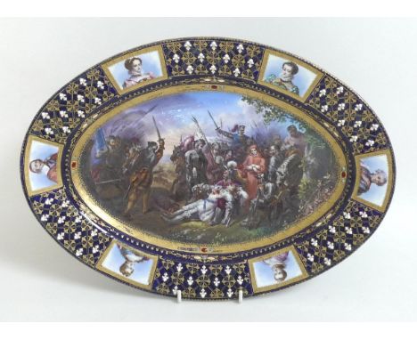 A 19th century Sevres style porcelain oval dish, decorated with a central reserve depicting the battle of Ravenne, within a w