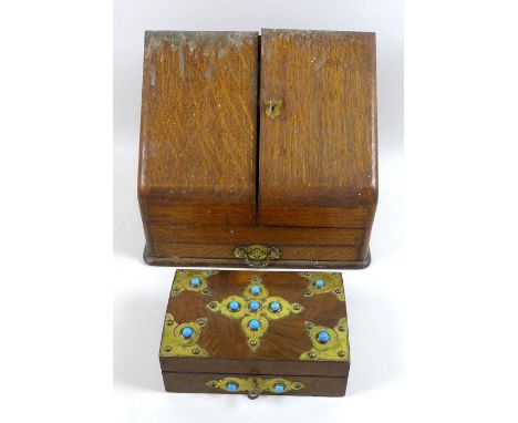 An early 20th century wooden jewellery casket, brass mounted and set with eleven turquoise cabochons, containing a small quan