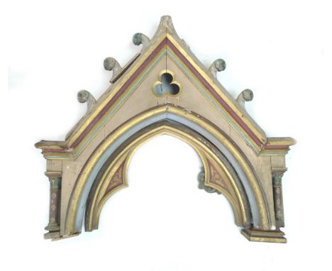 A Victorian Gothic architectural pediment in the style of A. W. N. Pugin, in original polychrome colours with gilded highligh