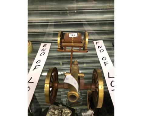A BRASS CANNON ON WOODEN CARRIAGE TOGETHER WITH AN AMMUNITION WAGON