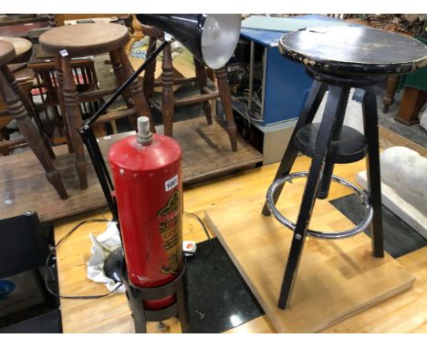 AN ANGLE POISE LAMP, A VINTAGE FIRE EXTINGUISHER AND A STOOL.  