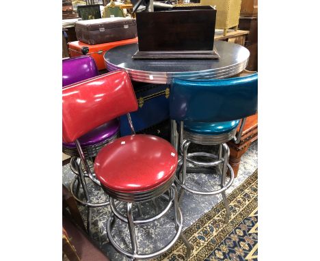 A VINTAGE 50'S STYLE CHROME HIGH CAFE TABLE AND THREE MATCHING STOOLS. 