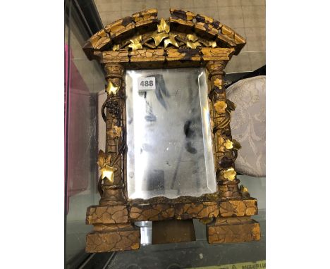 A CARVED GILTWOOD EASEL BACK MIRROR. 