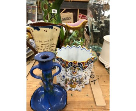 A MAJOLICA JUG, TWO OTHER JUGS, A QUIMPER TWO HANDLED PLANTER AND A TORQUAY WARE CANDLESTICK