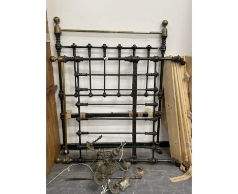 A BRASS AND IRON ANTIQUE SINGLE BED, TOGETHER WITH A BRASS CHANDELIER.