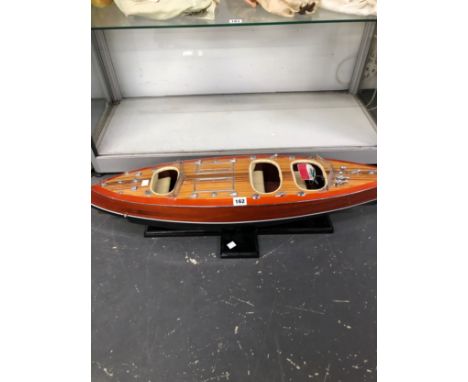 A SCALE MODEL SPEED BOAT ON A BESPOKE STAND AND FLYING THE ITALIAN NAVAL COLOURS