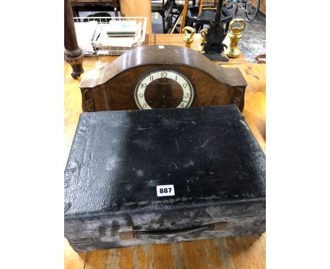 A PORTABLE GRAMOPHONE AND A MANTLE CLOCK.