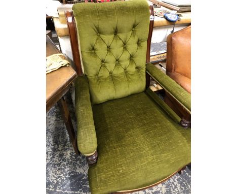 A VICTORIAN BUTTON BACK ARMCHAIR. 