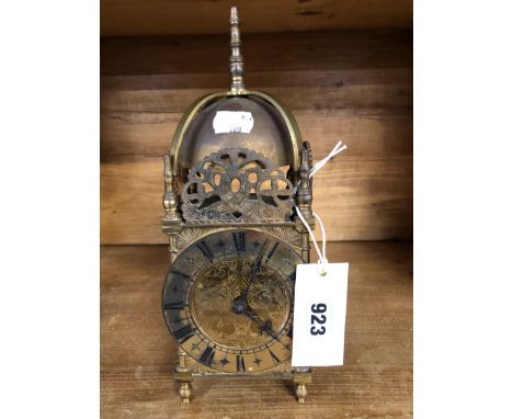 A BRASS LANTERN CLOCK. 