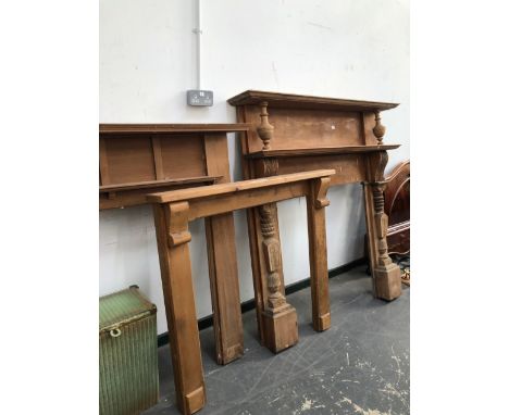 THREE VINTAGE WOODEN FIRE SURROUNDS, THE LARGEST W 148 X D 24 X H 151cms. 