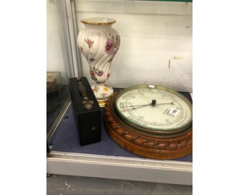 AN OAK CASED ANEROID BAROMETER, A BALUSTER VASE AND AN EASTMAN KODAK NO 3 FOLDING BROWNIE CAMERA