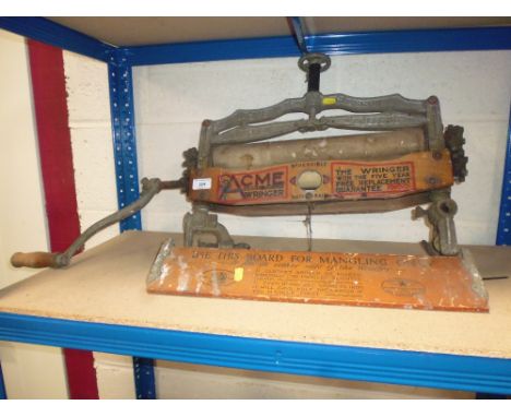 An Acme Manufacturing Co. of Glasgow 16" roller rubber wringer with board 
