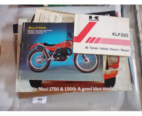 A folder containing various Austin motor car handbooks; a Bultaco motorcycle owners manual; and a Kawasaki KLF 220 All Terrai