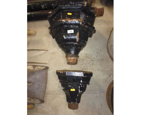 Two sections of cast iron pipe and two rain hoppers