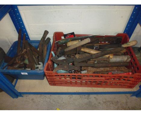 Two plastic baskets containing tools - cold chisels etc.
