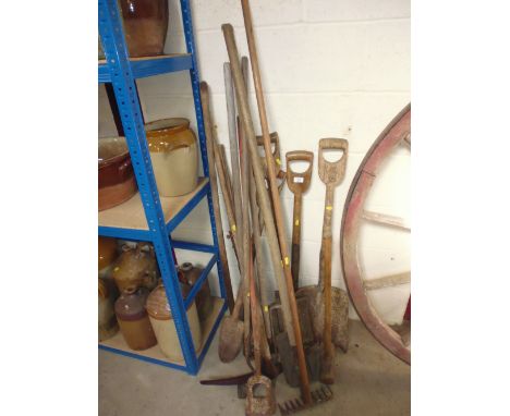 A quantity of long handled tools