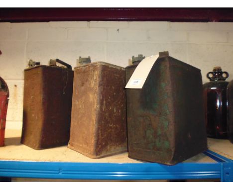 Three petrol cans (BP Motor Spirit, a Regent Motor Spirit and a Shell Motor Spirit)