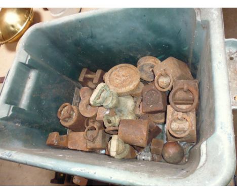 A quantity of small scale weights,three brass bell weights and one clock weight