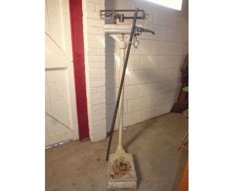 A large set of doctor's scales; and a height measuring stick 