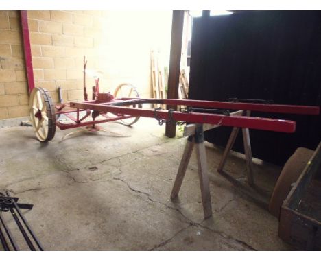A Simplex horse drawn thistle cutter, in working order with the shafts and with a Bamford toolbox fixed to top, (PLEASE NOTE 