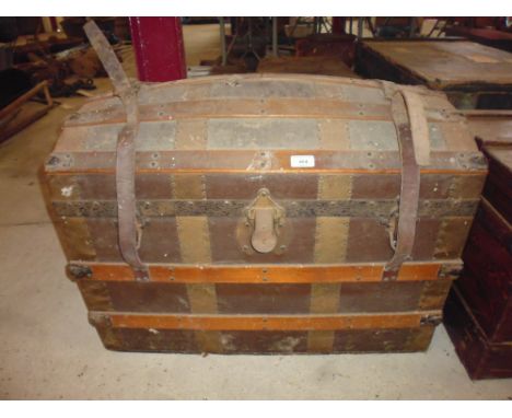 A wooden and canvas dome top trunk 