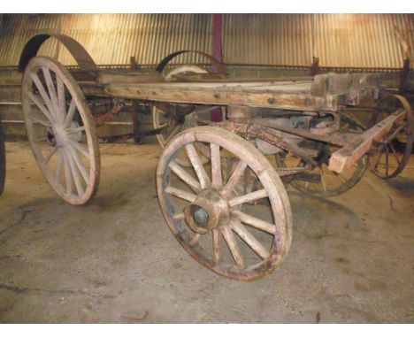 A horse drawn Lurry (flat bed four wheel cart) fully sprung with tractor draw bar fitted, the front hub caps bearing the name