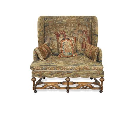 An early 20th century walnut settee or sofa of narrow proportionsin the Queen Anne styleWith gros and petit-point needlework 