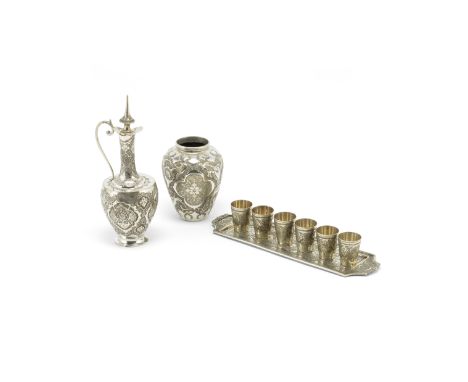 A Persian silver drinks set, with a carafe six beakers on a tray, together with a vasehallmarked Persian silver 84 (875), cit