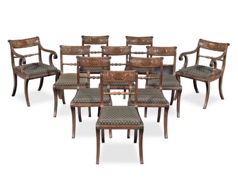 A set of ten Regency mahogany dining chairsCirca 1815, possibly Scottish, including two armchairs, each with a curved, dished