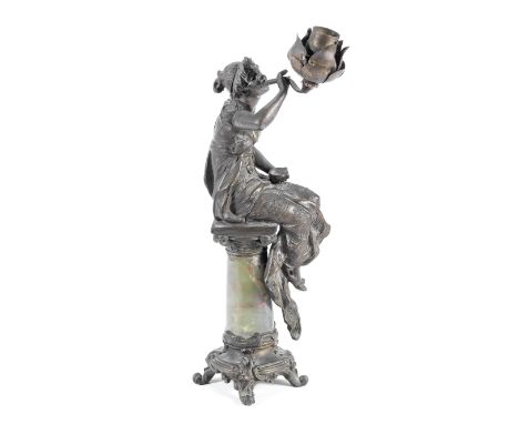 An early 20th century French bronzed spelter and onyx figural lampin the Art Nouveau taste, formed as a young maiden clad in 