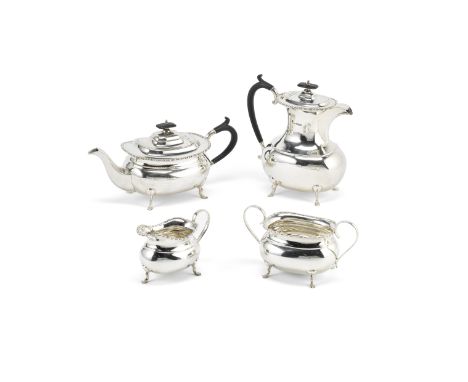 A silver four-piece tea serviceHarrison Fisher &amp; Co, Sheffield 1919Plain oval bellied form, bead and reel rims, on paw su